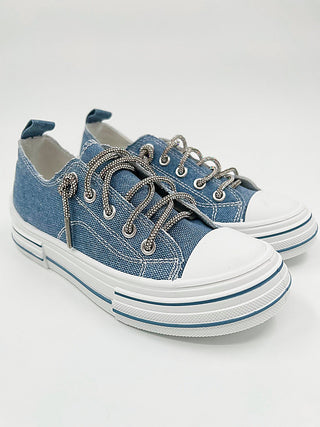 Blue denim canvas low-top sneakers with lace-up eyelets and sparkly accents