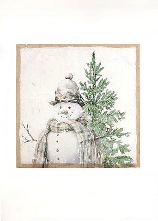 Vintage winter sign with snowman, evergreen tree, and falling snow, in a white frame.