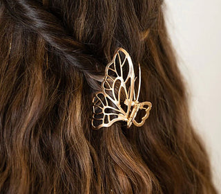Gold butterfly claw hair clip with spiral detail