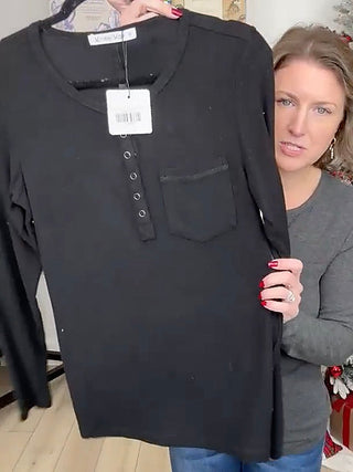 Black rayon-blend long-sleeve henley top with small chest pocket and button placket