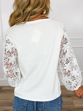 Back of ivory cotton-blend top with lace 3/4 sleeves