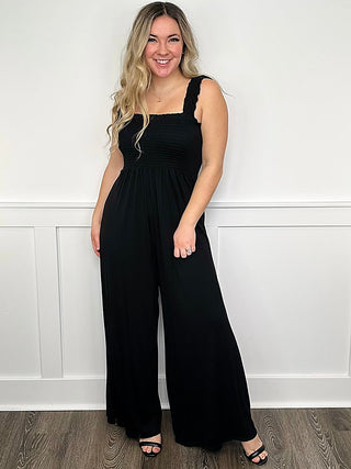 Black sleeveless jumpsuit with square neckline and wide-leg pants