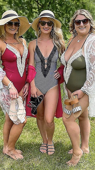 One-piece swimsuit with black lace trim and black-and-white striped body
