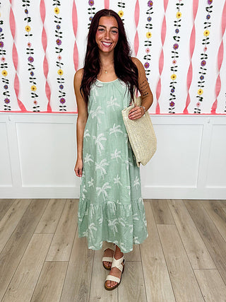 Green cotton sleeveless maxi dress with white leaf print and tiered hem