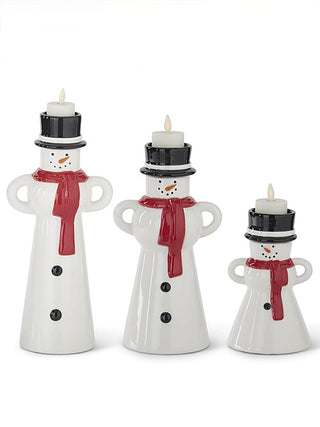 Ceramic snowman candle holders set of 3 with lit candles, red scarf, black hat tops