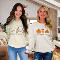 Women's crewneck sweatshirts: fall graphic crewnecks with Fall word art and Sweater Weather pumpkin, latte and maple leaf prints, styled with jeans