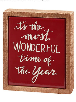 Wood shelf sitter with a rustic frame, red center, and white holiday lettering