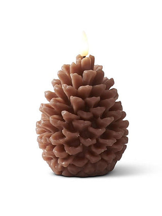Brown pine-cone-shaped LED candle with lit wick flame