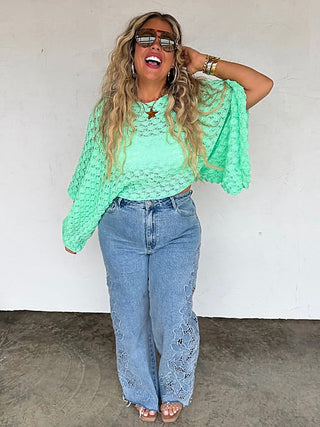 Mint green knit long-sleeve cropped sweater with textured openwork and wide cuffs