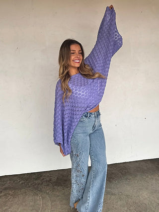 Purple knit long-sleeve cropped sweater with textured pattern and relaxed fit