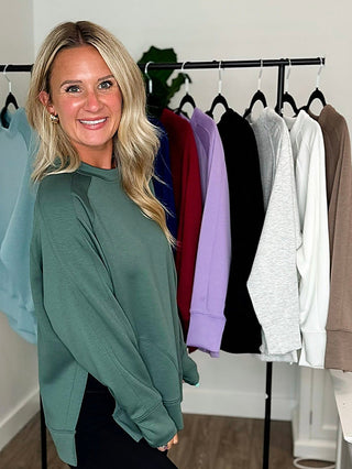 Women’s long-sleeve weekender top in deep green, crew neckline, relaxed fit