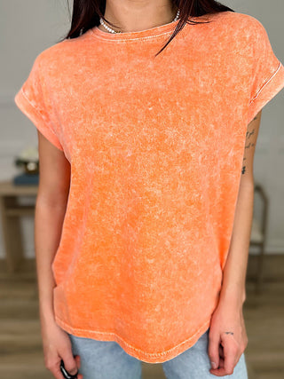 Orange short-sleeve cotton crewneck top, loose fit with washed speckled texture